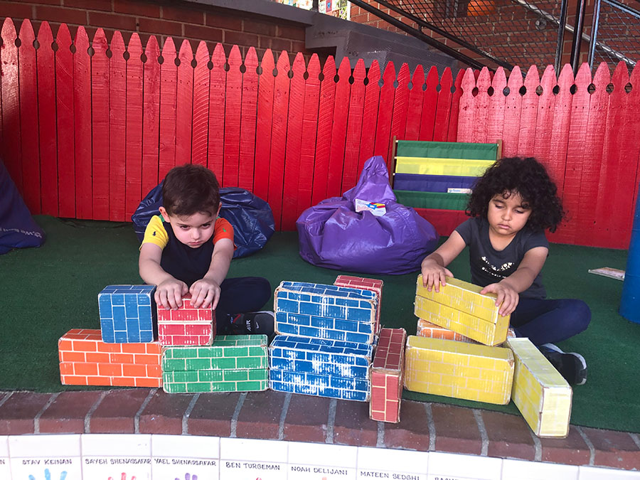 ECC students playing with building blocks